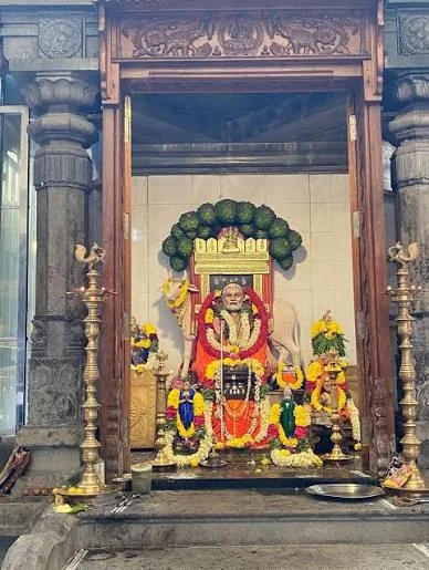 Sri Raghavendra Matha shrine, decorated with garlands and oil lamps